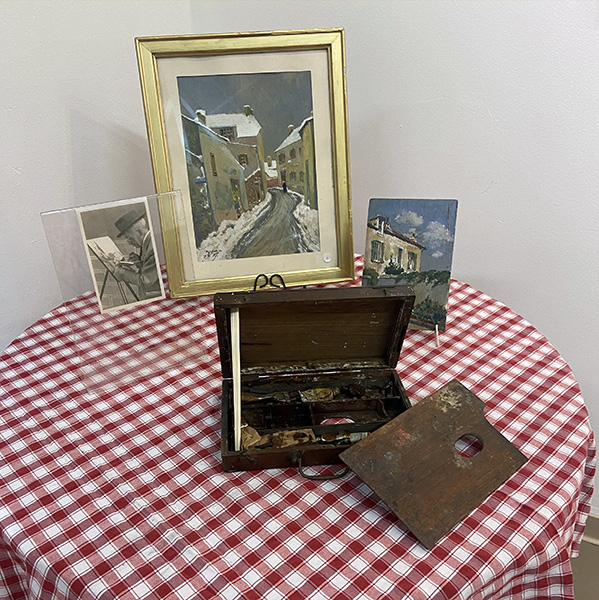 Une table présentoir avec vue de Pissefontaine par temps de neige et la palette du peintre ID338 03 Expo Schlienger